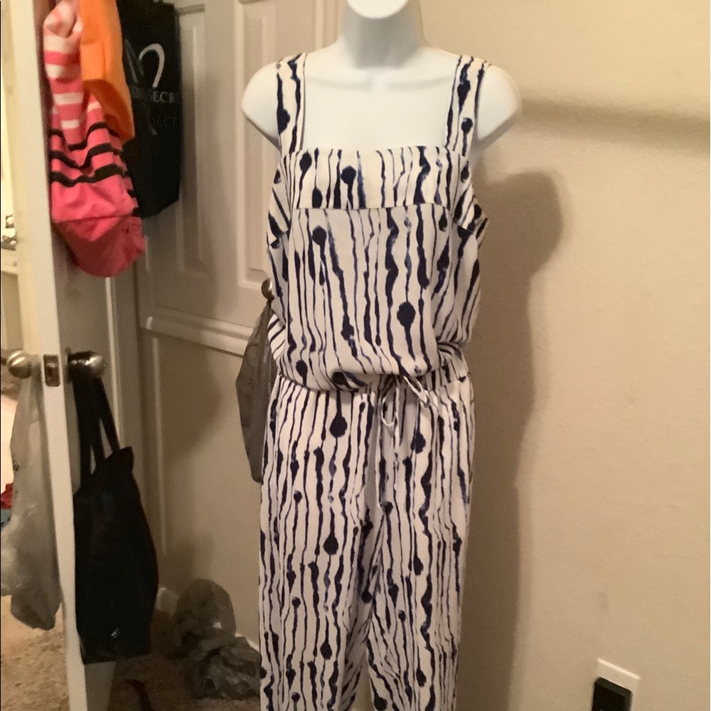 Two piece tank and pants white w purple accents .